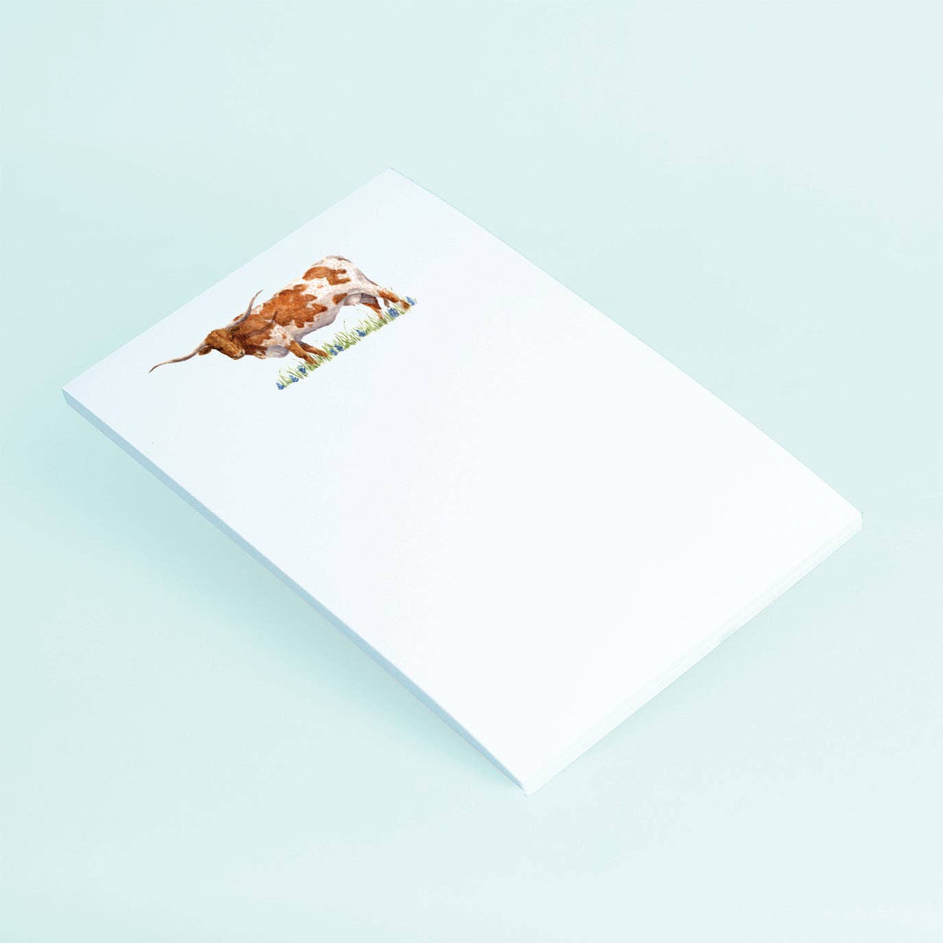 Taylor Paladino Standing Texas Longhorn in A field of Bluebonnets Notepad